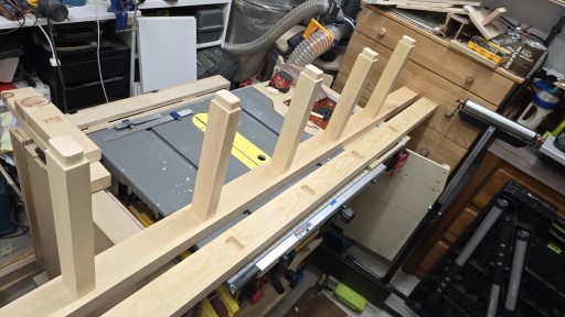 The steps are seated into the mortises, and then two screws on each end are holding them in place