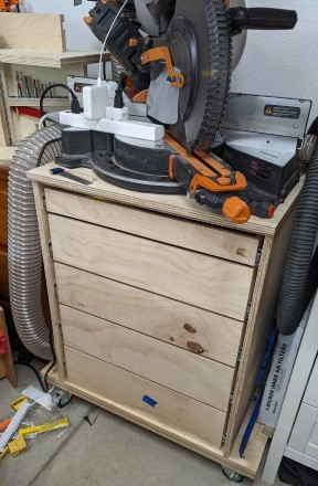 The miter saw station cabinet with the drawers installed