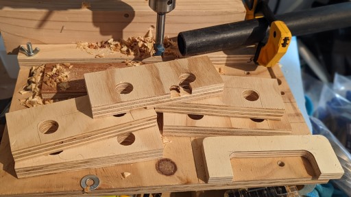 Drilling out the inner rounded corners of the future handles on a drill press