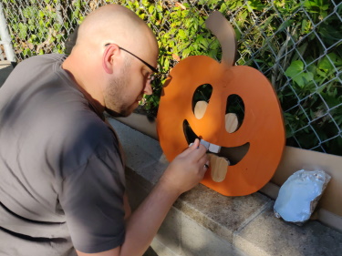Painting the details on a pumpkin